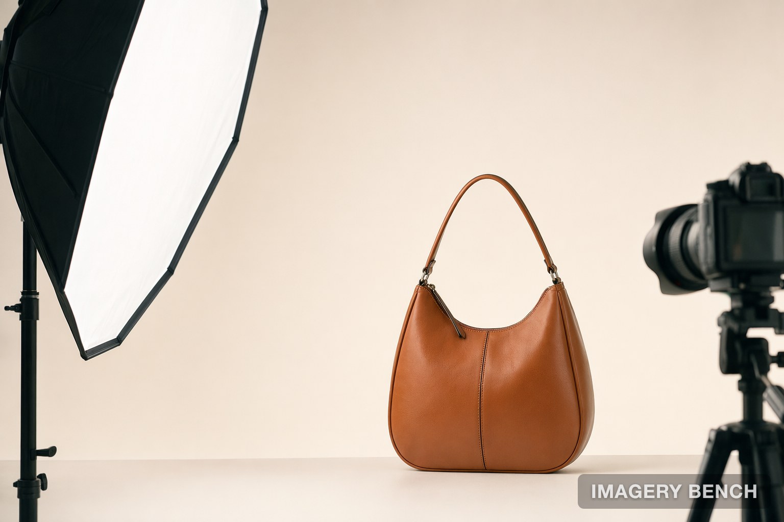 A leather handbag on a seamless backdrop in a product photography set